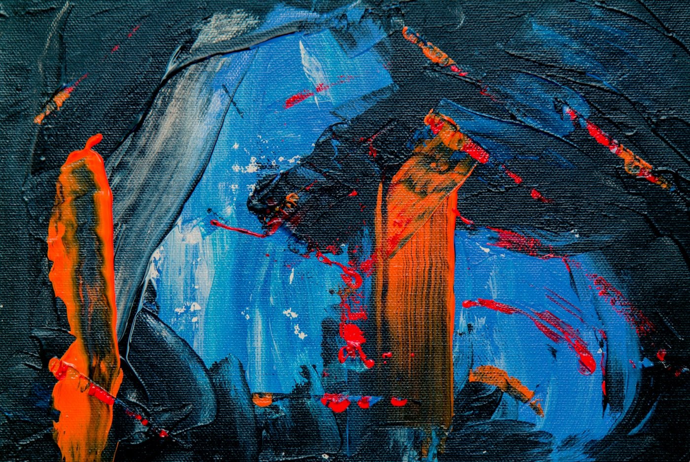 Vibrant glow paint on canvas in a blacklit studio