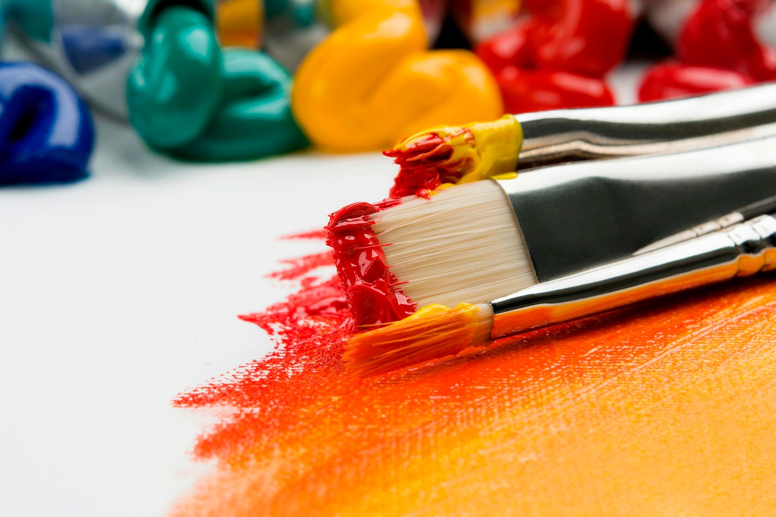 Artists painting under colorful lights